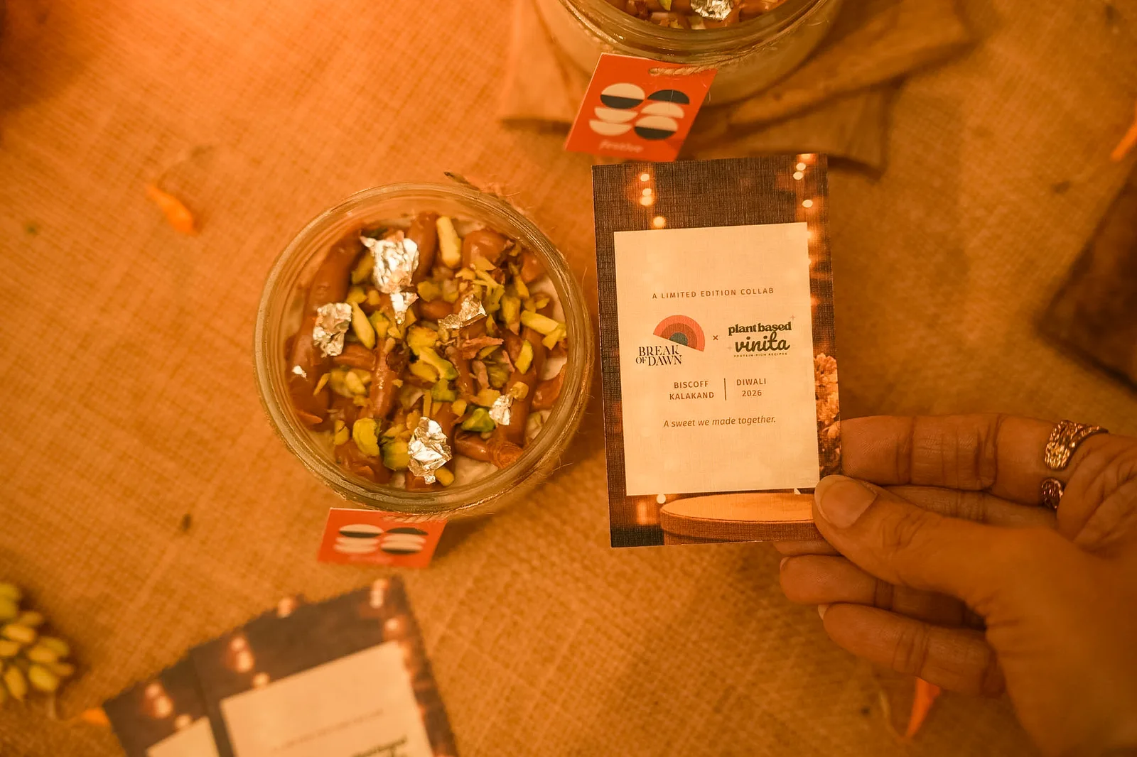 The Biscoff kalakand and the Break of Dawn × Plant Based Vinita card, from above
