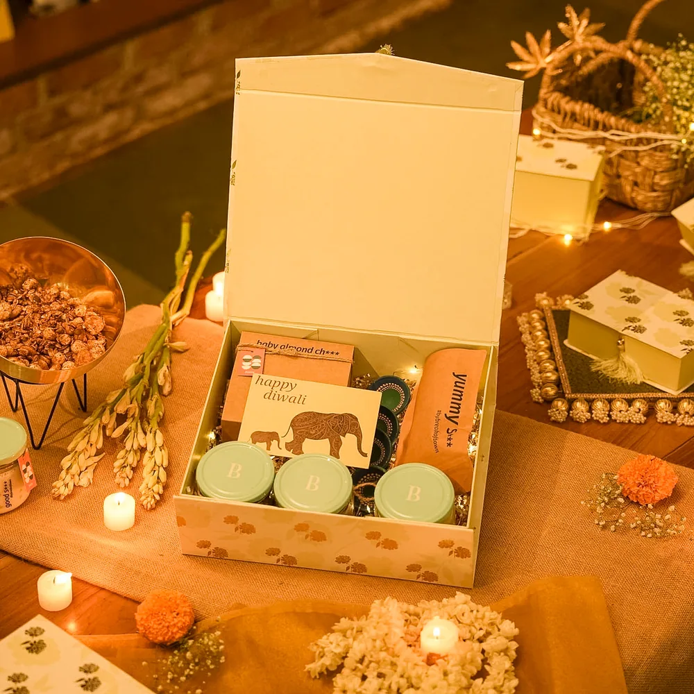 A floral paper gift box with a tassel