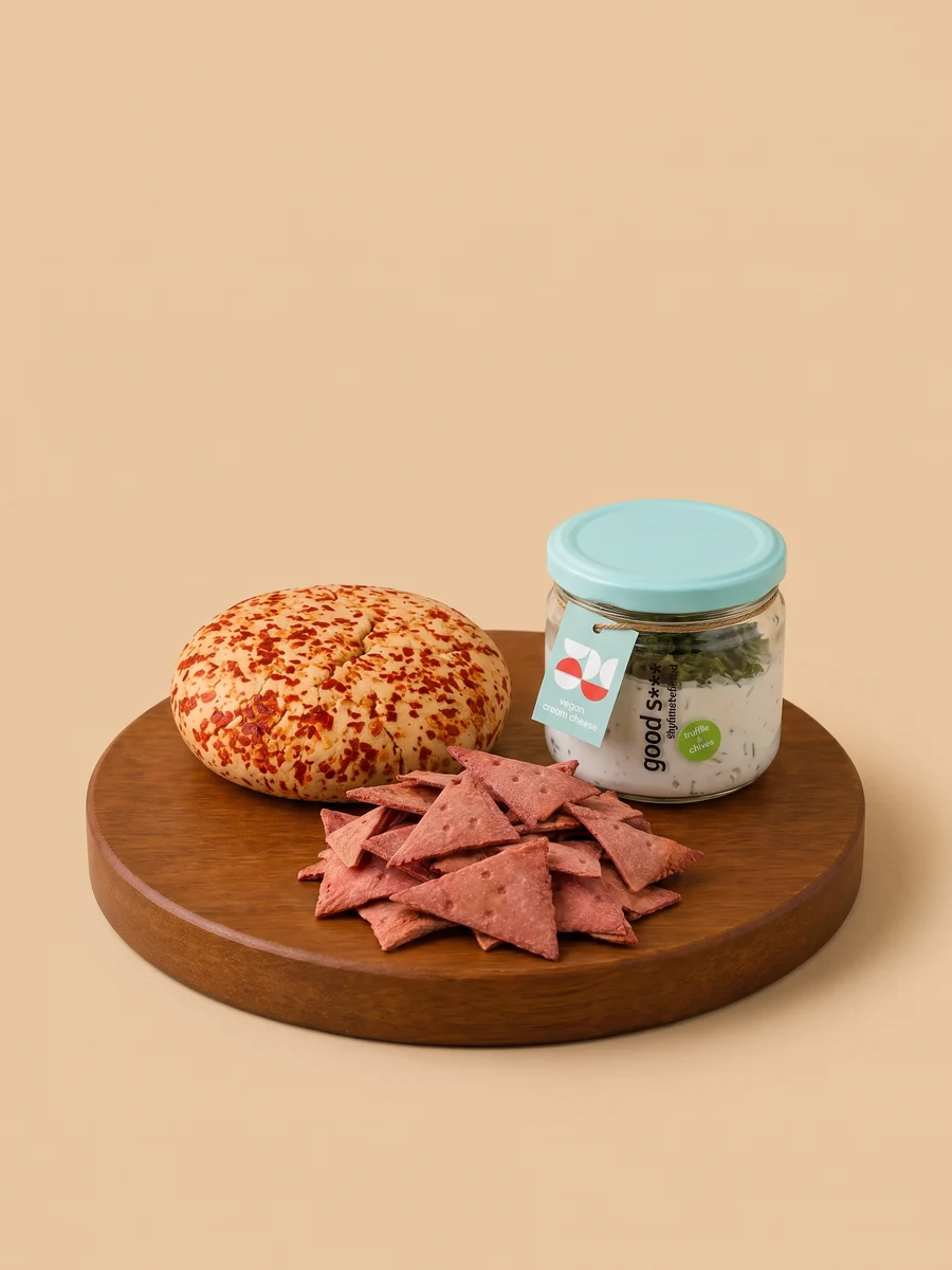 The Cheese Board bundle from Break of Dawn on a wooden board: chilli garlic almond feta, truffle & chives cream cheese and beetroot lavash