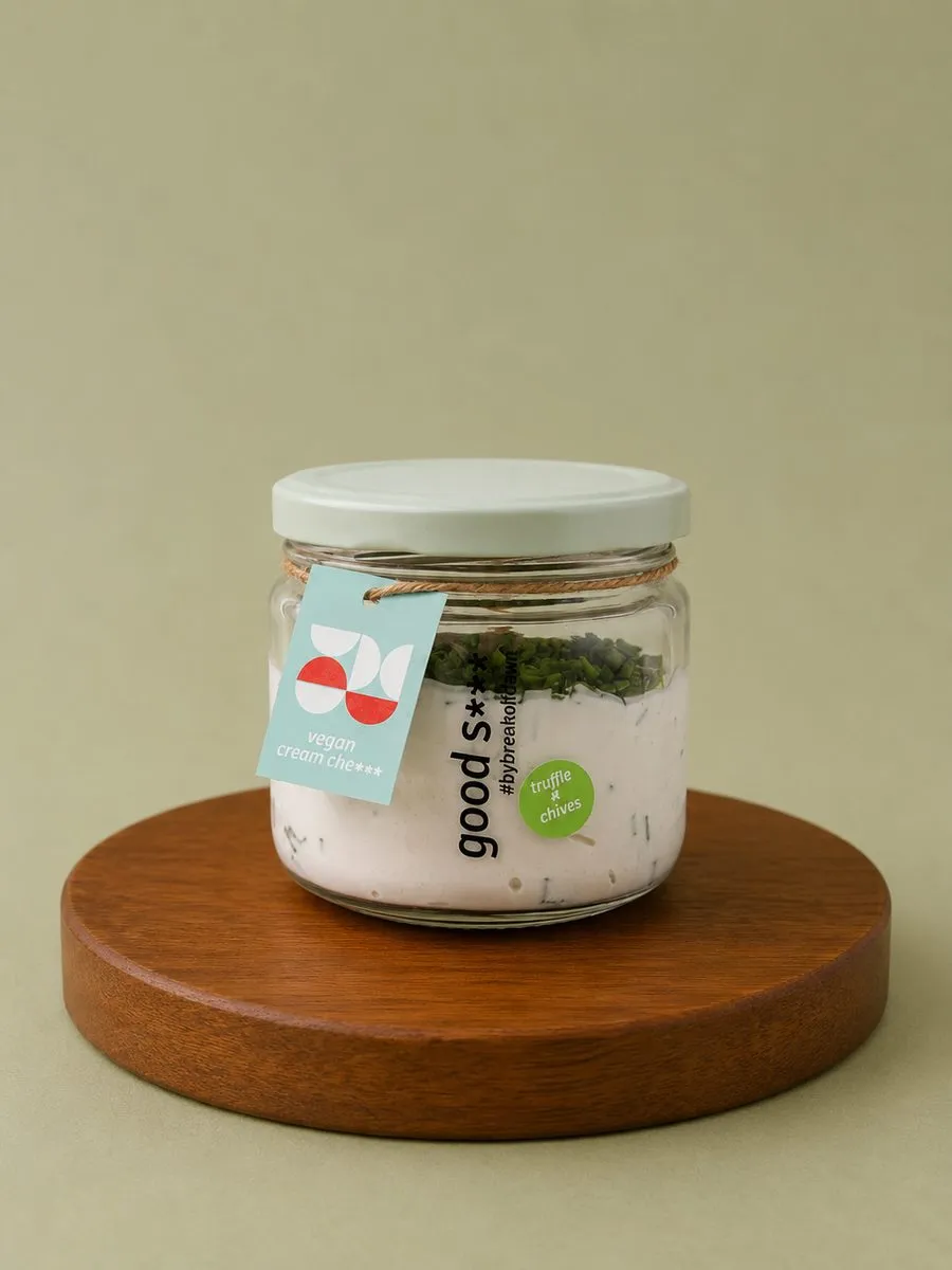A wheel of Break of Dawn truffle & chives feta, cultured nut-based feta made from almonds