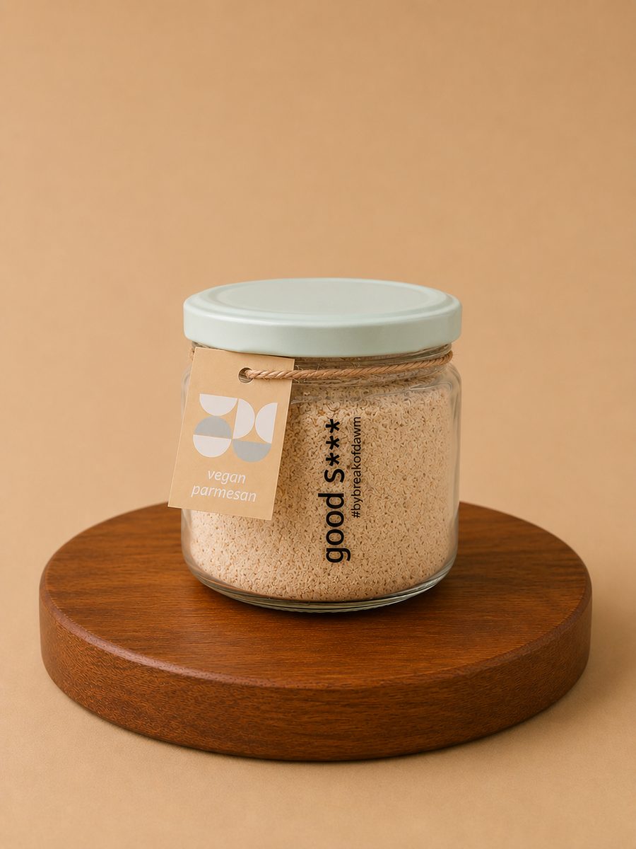 A jar of Break of Dawn vegan parmesan, a plant-based hard cheese alternative